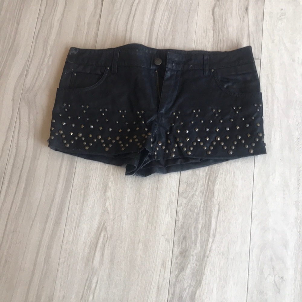 Free People studded faux leather shorts.